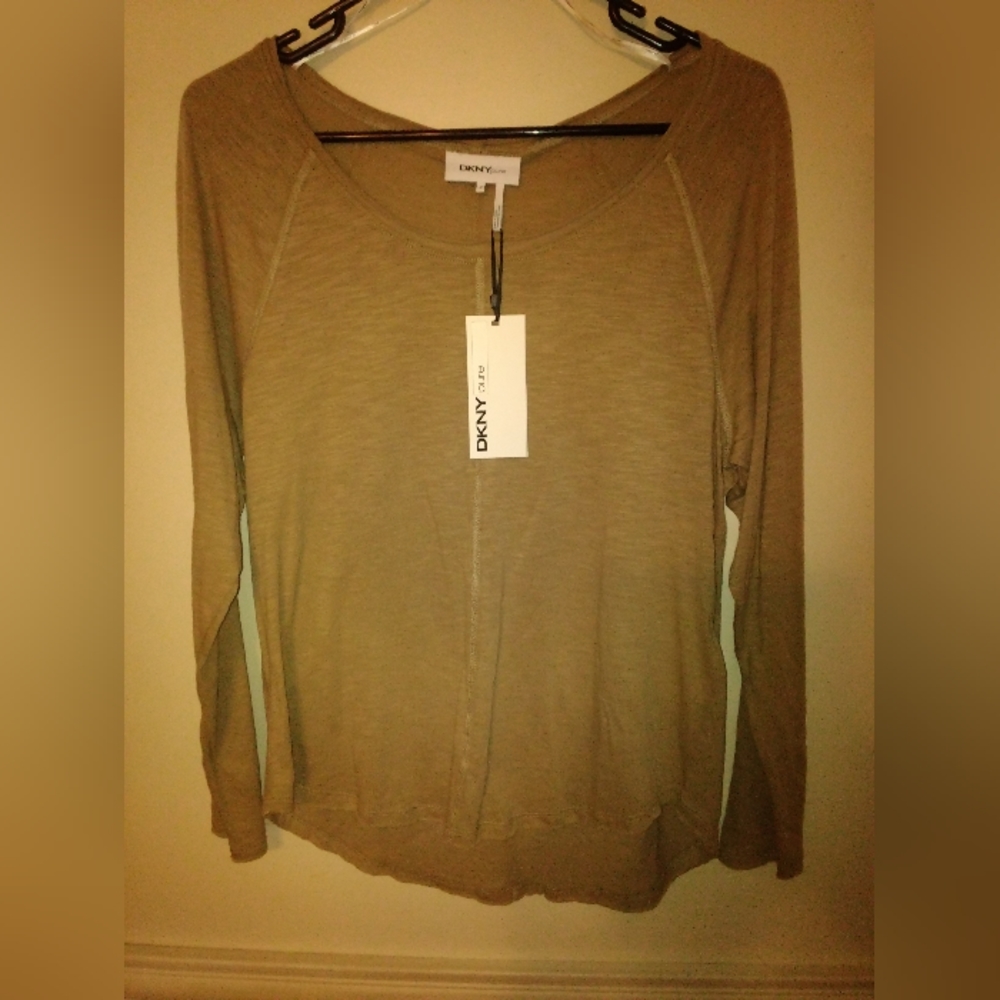 DKNY long sleeve shirt size medium, color lichen a beige color. Still with tags